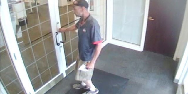 Video surveillance shows Menser walking into a bank with a demand note saying he has a gun.