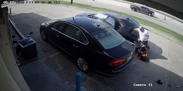 The woman was run over with a car while two thieves attempted to take her purse -- which was filled with $75,000.