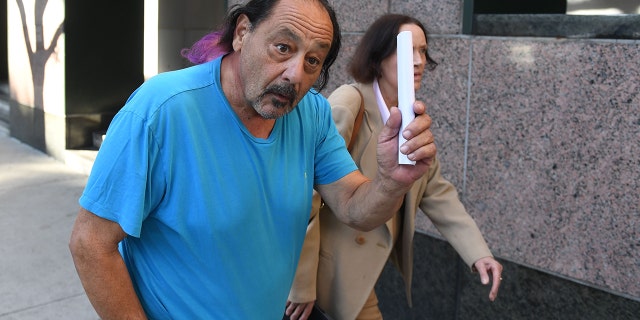Robert Chain, 68, walking alongside his wife, as they leave the Los Angeles courthouse after being released on bail on Aug. 30.