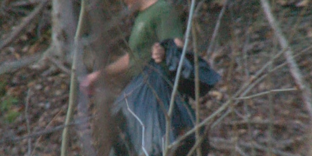 Investigators leave area near New River Gorge Bridge with evidence.