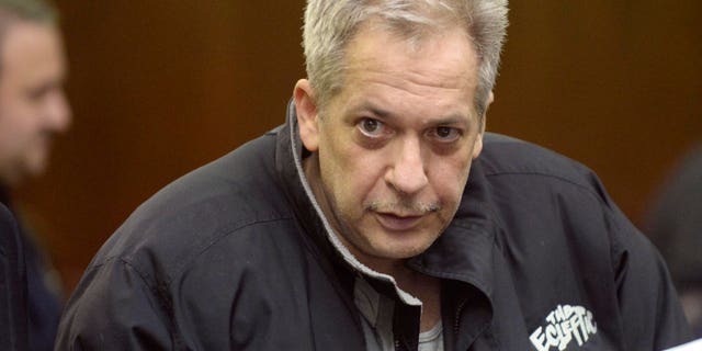 February 5, 2014. Robert Vineberg stares at a camera during his arraignment in court in New York. Three men and one woman arrested in New York have been charged with drugs offences possibly connected to narcotics found at the home of film star Philip Seymour Hoffman following his death of an apparent heroin overdose, law enforcement officials said.