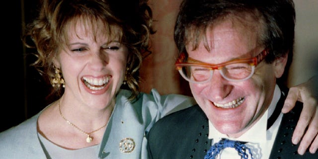 Pam Dawber shares a laugh with Robin Williams before the annual American Museum of the Moving Image Tribute dinner on Feb. 23, 1995, in New York.