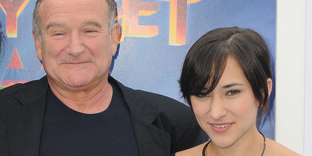 This Nov. 13, 2011 file photo shows actor Robin Williams, left, and his daughter, Zelda at the premiere of "Happy Feet Two" in Los Angeles.