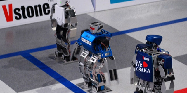 Robots line up for a race during a press conference Wednesday, Feb. 16, 2011, announcing the world's first full marathon for robots will be kicked off on Feb. 24 in Osaka, western Japan.