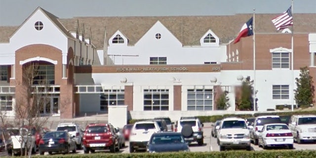 Rockwall-Heath High School says it has suspended its girl's varsity soccer team coach.