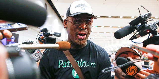 Former NBA basketball player Dennis Rodman is surrounded by the media after arriving from North Korea's Pyongyang at Beijing airport, China June 17, 2017. (REUTERS/Thomas Peter)