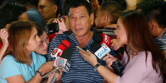 April 22, 2016: Front-running presidential candidate Mayor Rodrigo Duterte talks to the media during a campaign sortie at Silang township, Cavite province south of Manila, Philippines