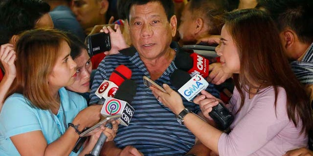 April 22, 2016: Front-running presidential candidate Mayor Rodrigo Duterte talks to the media during a campaign sortie at Silang township, Cavite province south of Manila, Philippines