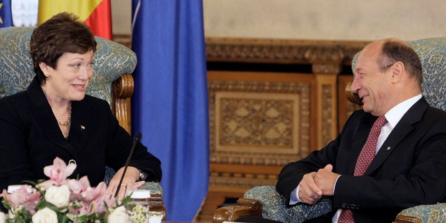 May 3: U.S. Undersecretary of State Ellen Tauscher, left, smiles during the meeting with Romanian President Traian Basescu, right, in Bucharest, Romania. Basescu announced the decision Tuesday in Bucharest to build a missile interceptor site at the Daveselu air base near the Bulgarian border. Romania already had agreed to host the interceptors, but the location had not been announced. (AP)