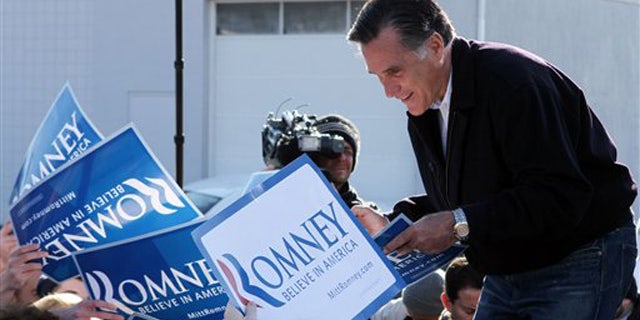Dec. 3, 2011: Mitt Romney speaks to supporters and volunteers during a rally in Manchester, N.H.