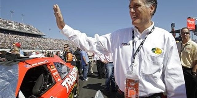 Feb. 20: Former Massachusetts Gov. Mitt Romney waves to fans before the Daytona 500 NASCAR auto race at Daytona International Speedway in Daytona Beach, Fla.