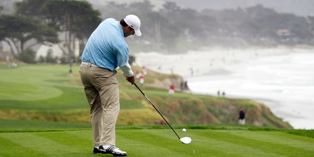 Former Dallas Cowboys quarterback Tony Romo tees off during a practice round ahead of this week's AT&T Pebble Beach National Pro-Am