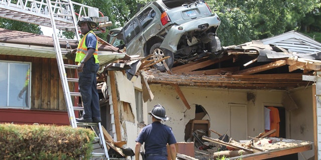 A car crashed into a St. Louis home Sunday while the owner was at the gym.