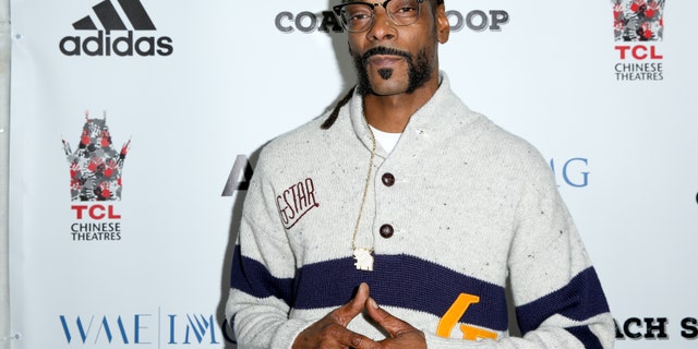 FILE - In this, May 16, 2016, file photo, Snoop Dogg arrives at the LA Premiere of "Coach Snoop" at the TCL Chinese 6 Theatres in Los Angeles. Snoop Dogg called for a boycott of the History Channel's "Roots" remake in an Instagram post on May 30, 2016. (Photo by Rich Fury/Invision/AP, File)