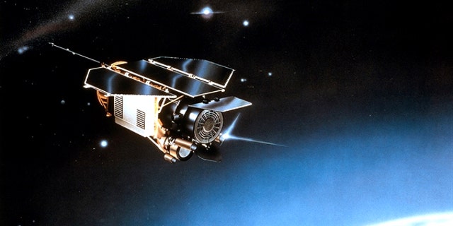 An artist's impression of the German ROSAT satellite orbiting in space.