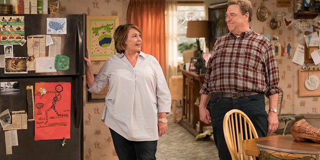 This image released by ABS shows Roseanne Barr, left, and John Goodman in a scene from the comedy series "Roseanne." ABC's "Roseanne" revival is in the running for Emmy nominations Thursday, but will TV academy voters overlook its star's racist tweet that brought the sitcom to an abrupt end?