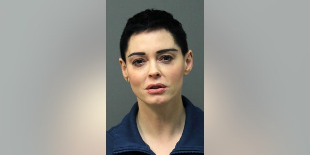 This image released Tuesday, Nov. 14, 2017 by the Loudoun County Sheriff's Office shows the booking photo for actress Rose McGowan who surrendered to Airports Authority Police on charges of possession of a controlled substance. The felony charge stems from a police investigation of personal belongings left behind on a Jan. 20 flight that arrived at Washington Dulles International Airport in Virginia. Police say the items tested positive for narcotics. (Loudoun County Sheriff's Office via AP)