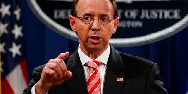 Deputy Attorney General Rod Rosenstein speaks during a news conference at the Department of Justice, Friday, July 13, 2018, in Washington. (AP Photo/Evan Vucci)