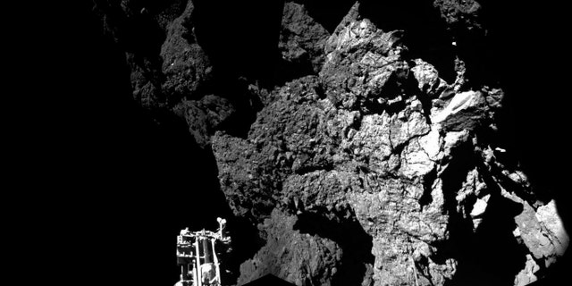 Rosetta’s lander Philae is safely on the surface of Comet 67P/Churyumov-Gerasimenko, as these first two CIVA images confirm. One of the lander’s three feet can be seen in the foreground. ( ESA/Rosetta/Philae/CIVA)