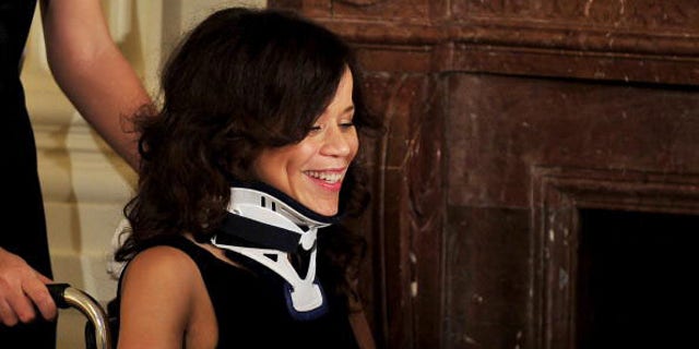 WASHINGTON - JULY 13:  (AFP OUT) Actress Rosie Perez awaits the arrival of U.S. President Barack Obama to speak about the new National HIV/AIDS Strategy (NHAS) in the East Room of the White House July 13, 2010 in Washington, DC. The strategy, unveiled today by the White House, aims to use federal inter-agency and inter-department resources to reduce the number of people who become infected with HIV, increase access to care and optimizing health outcomes for people living with HIV and reduce HIV-related health disparities.  (Photo by Ron Sachs-Pool/Getty Images)
