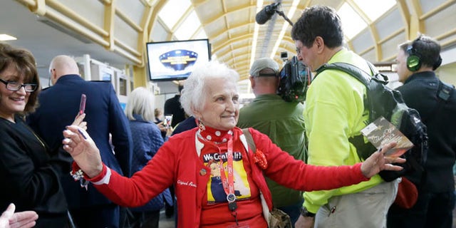 March 22, 2016: Former Rosie, Sylvia Tanis is greeted at the Ronald Reagan Washington National Airport.
