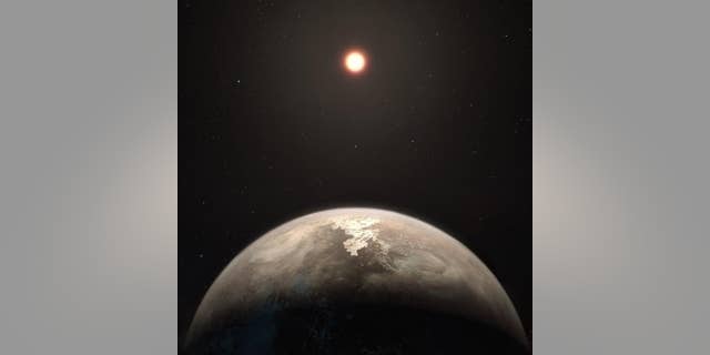 This artist’s illustration shows the potentially temperate planet Ross 128b, with its red dwarf parent star in the background.