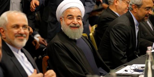 Iranian President Hassan Rouhani smiles ahead of a meeting in Paris, Wednesday, Jan. 27, 2016. Rouhani says his first visit to Europe since the nuclear accord was signed has proven that there are "great possibilities" for economic, academic, scientific and cultural cooperation and that "today we are in a win-win situation" after years of mutual losses due to sanctions. (AP Photo/Christophe Ena)