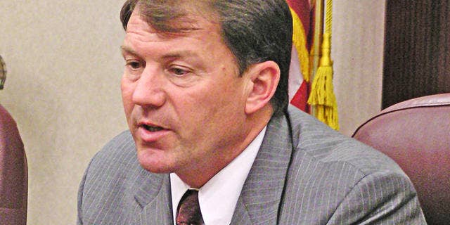 Then-South Dakota Gov. Mike Rounds speaks during a press conference at the state Capitol in Pierre, S.D.