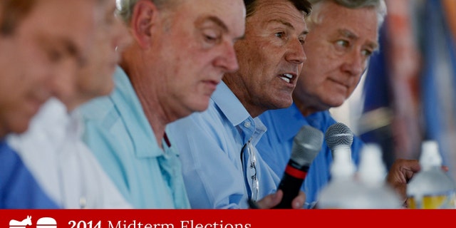 Aug. 27, 2014: South Dakota GOP Senate candidate Mike Rounds speaks while debating rivals Rick Weiland, Larry Pressler and Gordon Howie at Dakotafest in Mitchell, S.D.