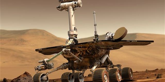 This artist rendering released by NASA shows the NASA rover Opportunity on the surface of Mars. Opportunity landed on the red planet on Jan. 24, 2004 and is still exploring. Its twin Spirit stopped communicating in 2010. (AP Photo/NASA)
