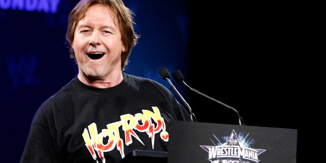 WWE Hall of Fame Wrestler "Rowdy" Roddy Piper speaks during a press conference for the 25th Anniversary of WrestleMania, as wrestler Chris Jericho (R) looks on in New York March 31, 2009. The 25th Anniversary of WrestleMania will take place at Reliant Stadium in Houston, Texas April 5.     REUTERS/Brendan McDermid (UNITED STATES) - RTXDGPP