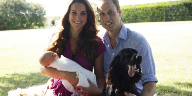 This image taken by Michael Middleton, the Duchess's father, in early August 2013 and supplied by Kensington Palace, shows the Duke and Duchess of Cambridge with their son, Prince George, in the garden of the Middleton family home in Bucklebury, England, with Tilly the retriever, seen left, a Middleton family pet, and Lupo, the couple's cocker spaniel.