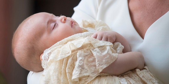 Prince Louis sleeps through his royal christening.