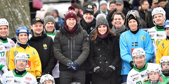 Britain's Catherine, Duchess of Cambridge and Prince William, Duke of Cambridge pose together with youth from the Hammarby bandy sports club, in Stockholm, Sweden January 30, 2018. Jonas Ekstromer/TT NEWS AGENCY/via REUTERS    ATTENTION EDITORS - THIS IMAGE WAS PROVIDED BY A THIRD PARTY. SWEDEN OUT. NO COMMERCIAL OR EDITORIAL SALES IN SWEDEN. - RC19015F3FB0