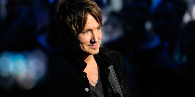 There's a reason (or three) why fans can't get enough of country star Keith Urban.