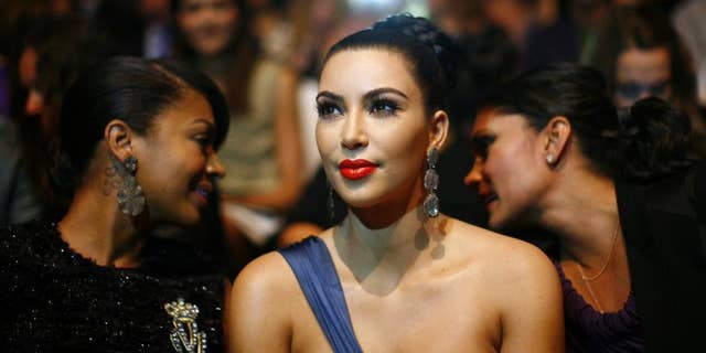 Kim Kardashian shared a photo on social media of herself and her sisters donning lingerie and Victoria's Secret wings for Halloween.