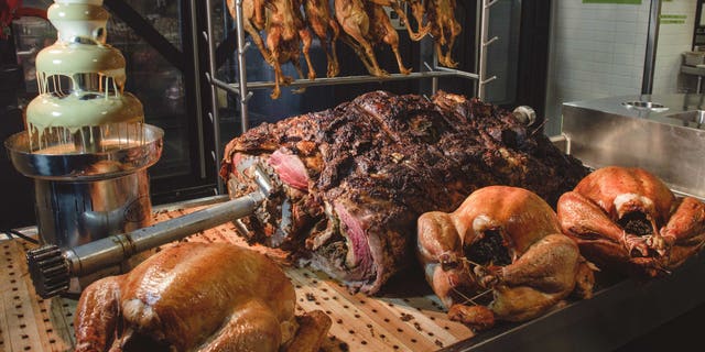 The massive roast is served at Bourboon Steak and Pub Tailgate party during San Francisco 49ers game versus the Seattle Seahawks on Thanksgiving Day.