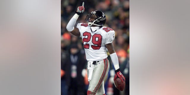 Keion Carpenter celebrating an interception in 2003.