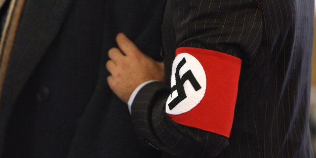 A theater in Germany will have some patrons wearing a swastika armband while others wear the Jewish Star of David for a satirical production about Adolf Hitler's youth.