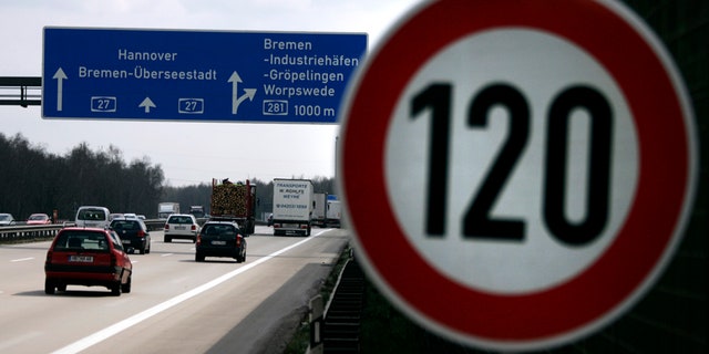 Cars pass a 120 km/h (75 mph) speed limit sign on the A27 Autobahn near the northern German city of Bremen April 10, 2008. The northern city of Bremen became Germany's first state to introduce a speed limit on its motorways on Wednesday, breaking a taboo in a country proud of its fast cars. REUTERS/Morris Mac Matzen (GERMANY) - RTR1ZBNZ