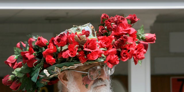 A race fan displays his hat before the 134th running of the Kentucky Derby horse race at Churchill Downs.