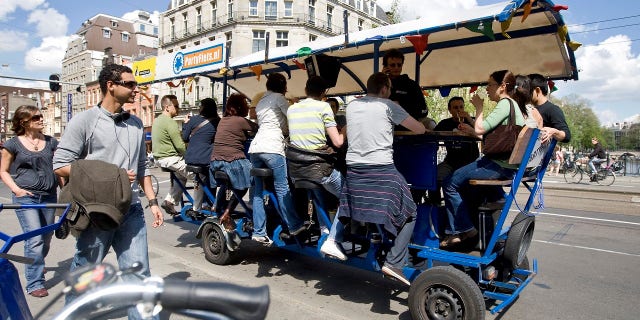 Beer bikes have been banned in Amsterdam's center after locals complained about rowdy tourists and the contraptions becoming a "nuisance."