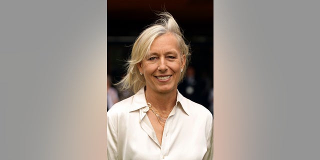 Martina Navratilova smiles after meeting Britain's Queen Elizabeth at the Queen attends the Wimbledon Lawn Tennis Championships at the All England Lawn Tennis and Croquet Club in London June 24, 2010.REUTERS/Pool/Oli Scarf (BRITAIN - Tags: SPORT TENNIS ROYALS ENTERTAINMENT) - RTR2FN8W