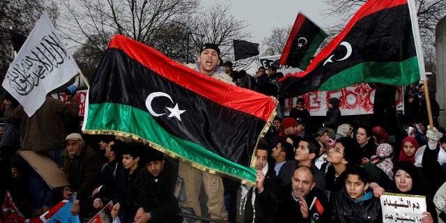 Demonstrators protest against Libya's Muammar Gaddafi outside the Libyan Embassy in London in 2011.