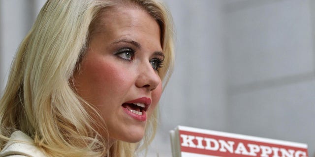 Elizabeth Smart talks to the media outside the Federal Courthouse after addressing her kidnapper, Brian David Mitchell, during his sentencing in Salt Lake City, Utah, May 25, 2011.