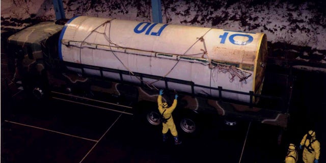 South Korean officer checking a piece of wreckage of North Korea's Unha-3 (Milky Way 3) rocket, at the Agency of Defense Development in Daejeon, south of Seoul.