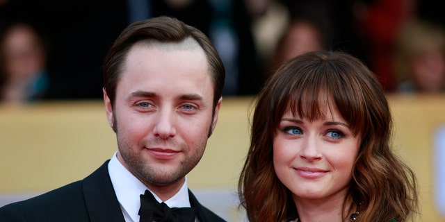 Actors Vincent Kartheiser and Alexis Bledel of the TV drama "Mad Men" arrive at the 19th annual Screen Actors Guild Awards in Los Angeles, California January 27, 2013.  REUTERS/Adrees Latif (UNITED STATES  - Tags: ENTERTAINMENT)  (SAGAWARDS-ARRIVALS) - RTR3D2AD