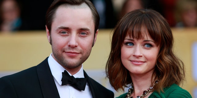 Actors Vincent Kartheiser and Alexis Bledel of the TV drama "Mad Men" arrive at the 19th annual Screen Actors Guild Awards in Los Angeles, California January 27, 2013. REUTERS/Adrees Latif (UNITED STATES - Tags: ENTERTAINMENT) (SAGAWARDS-ARRIVALS) - RTR3D2AD