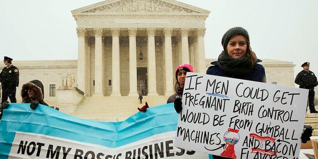 Protesters gathered outside the Supreme Court in 2014 as it began to hear arguments that challenged the ObamaCare mandate that requires employers to cover contraceptive measures through their insurance policies.