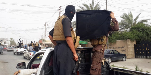 June 12, 2014: ISIS fighters in Mosul, Iraq. (Reuters)